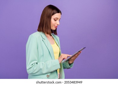 Profile portrait of charming positive person hold use tablet chatting social network isolated on purple color background