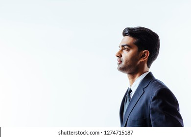 A Profile Portrait Of A Handsome Man In Suit And Tie Looking To Side 