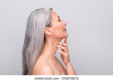 Profile Portrait Of Optimistic Nice Long Hair Woman Touch Chin Without Clothes Isolated On Light Grey Color Background