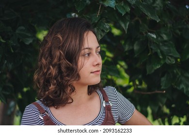 Profile Portrait Of A White Girl With Short Wavy Hair