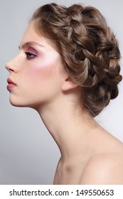 Profile Portrait Of Young Beautiful Girl With Braids Hairdo