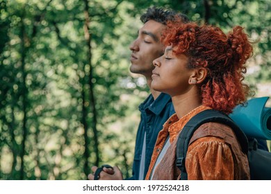 profile of relaxed couple breathing outdoors