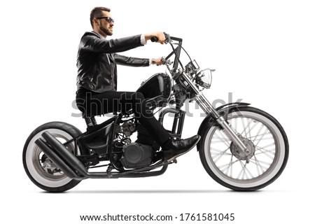 Profile shot of a biker on a custom chopper riding with sunglasses isolated on white background