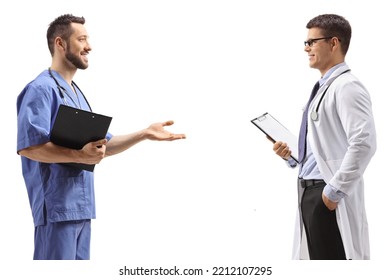 Profile Shot Of A Doctor And A Health Care Worker Talking Isolated On White Background