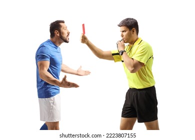 Profile shot of a football referee blowing a whistle and showing a red card to a confused player isolated on white background