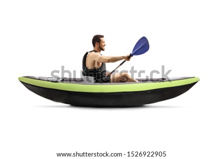 Profile shot of a guy with a safety vest kayaking isolated on white background