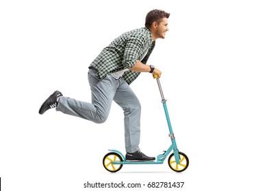 Profile Shot Of A Young Man Riding A Scooter Isolated On White Background