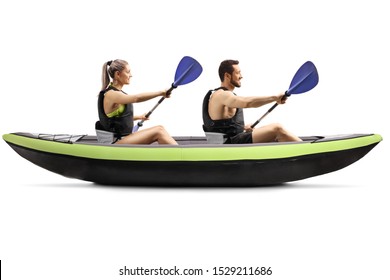 Profile shot of a young man and woman kayaking isolated on white background - Powered by Shutterstock