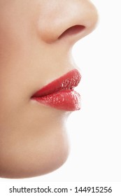 Profile Shot Of Young Woman With Red Lips On White Background