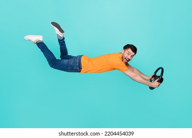 Profile Side Full Body Photo Of Guy Flying Fast Riding Futuristic Car Isolated On Cyan Color Background