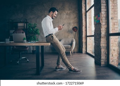 Profile side full length body size view of his he nice attractive cheerful cheery man ceo boss chief chatting with partner at modern loft brick industrial style interior workplace station indoors - Shutterstock ID 1722715069