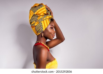 Profile side photo of afro american lady look empty space hold hand wear turban isolated on grey color background