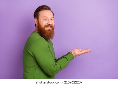 Profile Side Photo Of Cheerful Friendly Ginger Man Promoting Product Advertisement Isolated On Purple Color Background