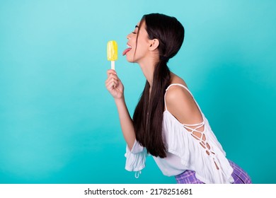 Profile Side Photo Of Cute Lovely Lady Lick Yummy Cold Fruit Juice Frozen Yogurt Pop Isolated Cyan Color Background