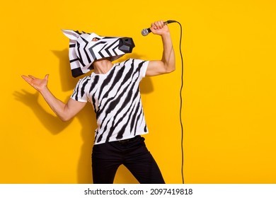 Profile side photo of freak guy in zebra mask sing mic popular song isolated over bright yellow color background