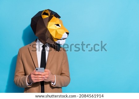 Profile side photo of freak guy in lion mask use smart phone text social-network discount look empty space isolated blue color background