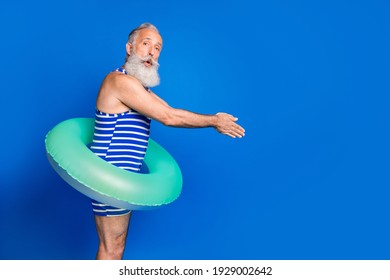 Profile Side Photo Of Handsome Shocked Amazed Old Man Jumping Into Swimming Pool Isolated On Blue Color Background