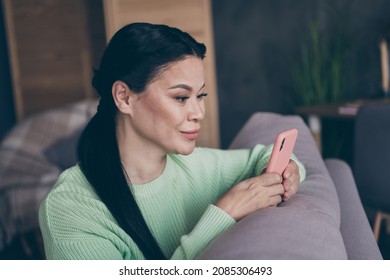 Profile Side Photo Of Lovely Mature Lady Look Cellphone Fast Connection 4g Comment User Addicted Indoors