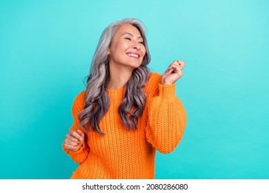 Profile side photo of mature cheerful pretty lady have fun clubber look empty space isolated over turquoise color background