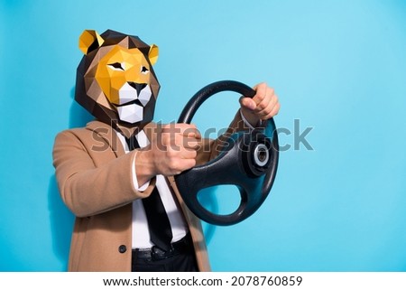 Profile side photo of weird anonym guy in lion mask ride steering wheel car go theme event isolated over blue color background