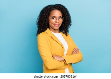 Profile Side Photo Of Young Afro Business Woman Wear Yellow Jacket Confident Crossed Hands Isolated Over Blue Color Background