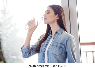 Profile side photo of young attractive woman happy positive smile enjoy drink water bottle hydration fresh indoors