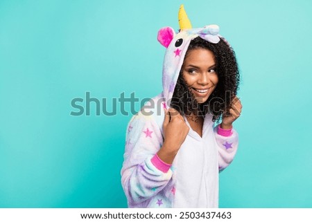 Profile side photo of young black woman happy positive smile wear kigurumi childish isolated over teal color background