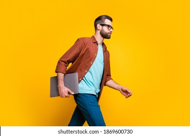 Profile Side Photo Of Young Business Man Freelancer Go Walk Meeting Hold Laptop Isolated Over Yellow Color Background