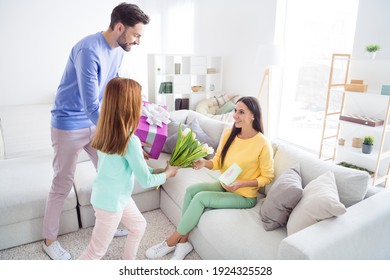 Profile Side Photo Of Young Family Dad Daughter Congratulate Mother Birthday Gift Present Flowers Celebration Surprise Indoors