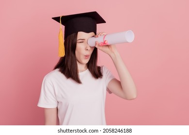 Profile side photo of young girl look diplome empty space playful amazed isolated over pink pastel color background - Shutterstock ID 2058246188