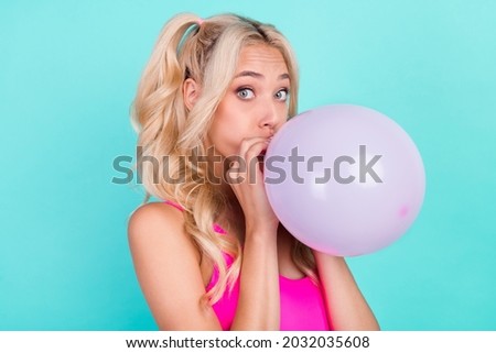 Profile side photo of young girl blow air balloons decor party birthday isolated over teal color background