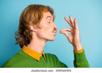 Profile side photo of young handsome funky funny man tasting enjoying delicisous food isolated on blue color background - Shutterstock ID 1909369393