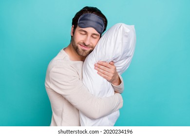 Profile Side Photo Of Young Man Happy Positive Smile Cuddle Pillow Sleep Night Cozy Isolated Over Teal Color Background