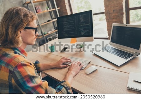 Profile side photo of young man typing keyboard coder programmer computer screen cyberspace virtual indoors