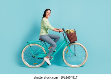 Profile Side View Of Attractive Cheerful Sporty Girl Riding Bike Spending Holiday Day Isolated Over Bright Blue Color Background