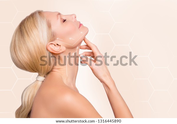 Profile side view\
half face portrait of nice charming attractive woman perfect neck\
arrows showing lifting direction massage recovery isolated over\
beige pastel background