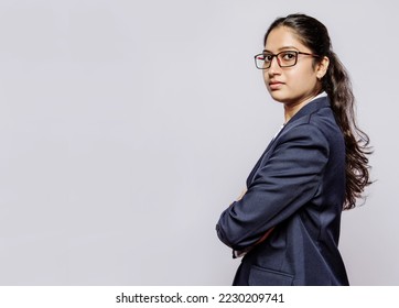 Profile side view headshot portrait of cute attractive lovely lovable charming pretty cheerful cheery black haired businesswoman girl with folded arms and spectacles isolated on grey color background. - Shutterstock ID 2230209741