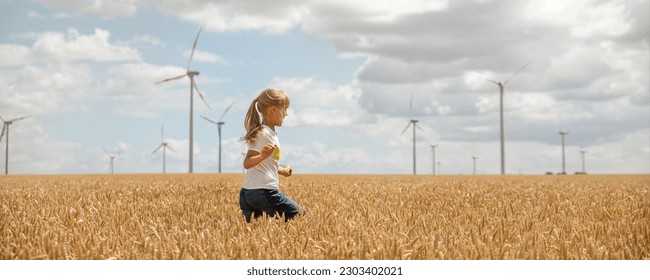 Profile side view little cute happy blond caucasian girl enjoy walking ripe wheat ear field against wind mill turbine farm warm sunny summer day. Child freedom future clean energy environment concept - Powered by Shutterstock