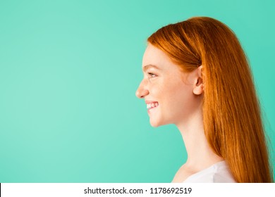 Profile Side View Photo Of Funny Lady Look In Front Of She, Make Wide Smile Isolated On Bright Turquoise Background With Copy Space For Text