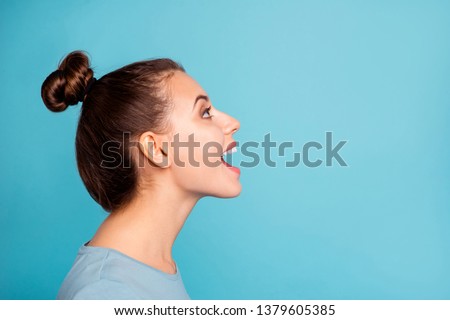 Profile side view photo of pretty youngster glad content enjoy shout news open mouth look up ads wear modern millennial pullover beautiful spring isolated on blue background