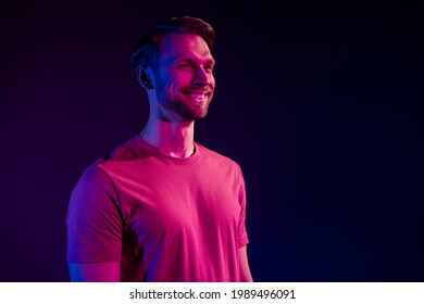 Profile Side View Portrait Of Attractive Cheerful Virile Guy Isolated Over Dark Neon Light Violet Color Background