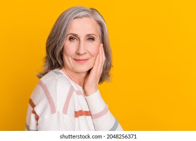 Profile Side View Portrait Of Attractive Healthy Grey-haired Woman Touching Clear Skin Copy Space Isolated Over Bright Yellow Color Background