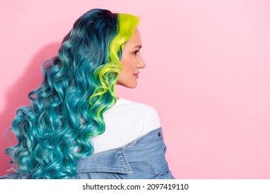 Profile side view portrait attractive wavy  haired girl healthy shine curls isolated over pink pastel color background