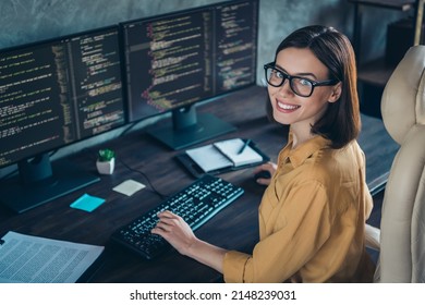 Profile side view portrait of attractive cheerful skilled girl geek developing web site cyber security at workplace workstation indoors - Shutterstock ID 2148239031