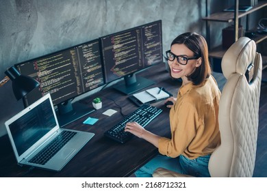 Profile side view portrait of attractive cheerful girl geek providing service cyber security at workplace workstation indoors