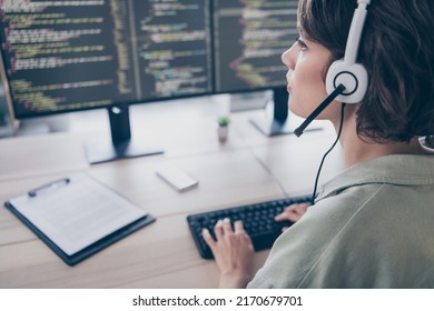 Profile side view portrait of attractive confident girl coding writing text solving task qa consulting client at work place station indoors