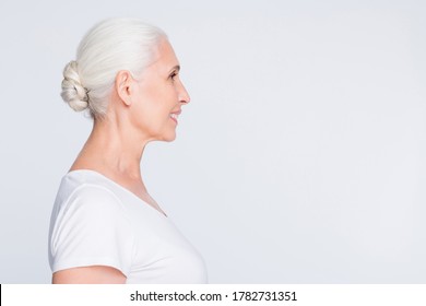 Profile side view portrait of her she nice-looking attractive cheerful cheery content shine gray-haired middle aged lady copy empty blank place space isolated on light white grey background