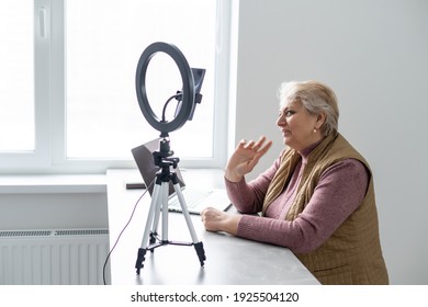 Profile Side View Portrait Of Her She Nice Attractive Addicted Focused Gray-haired Blonde Granny Playing Network Web Virtual Team Game At Industrial Loft Modern Concrete Style Interior House Flat