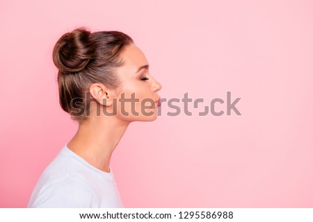 Profile side view portrait of her she nice cute attractive lovely sweet cheerful girl lady kissing you isolated over pastel pink background