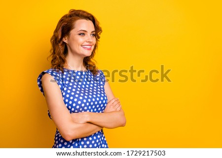 Profile side view portrait of her she nice attractive lovely content cheerful cheery wavy-haired girl wearing pinup dress folded arms isolated on bright vivid shine vibrant yellow color background